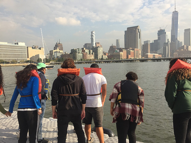 NYC 103 freshmen test water quality at the River Project at Pier 40 on the Hudson River.