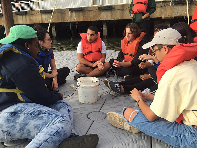 NYC 103 freshmen test water quality at the River Project at Pier 40 on the Hudson River.