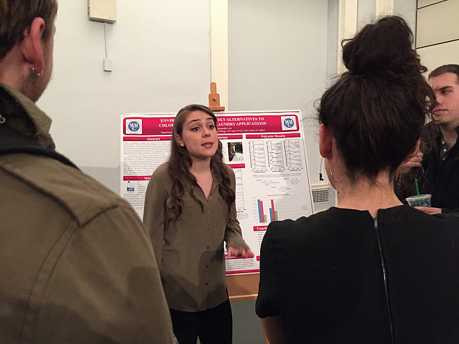 Katie Ness delivers her poster presentation on Environmentally Friendly Alternatives to Chlorine Bleaching in Laundry Applications.