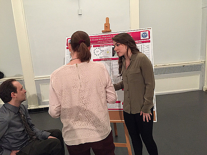 Katie Ness delivers her poster presentation on Environmentally Friendly Alternatives to Chlorine Bleaching in Laundry Applications.