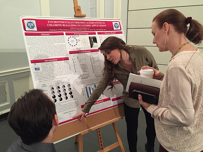 Katie Ness delivers her poster presentation on Environmentally Friendly Alternatives to Chlorine Bleaching in Laundry Applications.