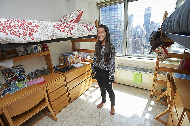 A resident in her new home at the 55th Street Residence Hall