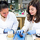 Biology students use microscope in lab