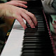 A theatre student playing the piano