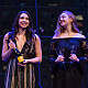 Students assist in kicking off the auction with a bottle of champagne