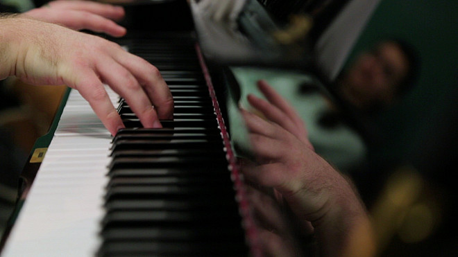 Theatre student playing the piano